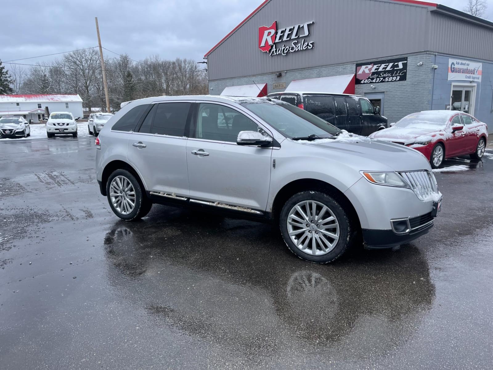 2014 Silver /Black Lincoln MKX Elite AWD (2LMDJ8JK4EB) with an 3.7L V6 DOHC 24V engine, 6-Speed Automatic transmission, located at 547 E. Main St., Orwell, OH, 44076, (440) 437-5893, 41.535435, -80.847855 - This 2014 Lincoln MKX AWD with the Elite Package offers a luxurious and well-appointed driving experience. Under the hood lies a robust 3.7-liter V6 engine mated to a smooth 6-speed transmission, delivering a balance of power and efficiency. Audiophiles will appreciate the premium THX audio system, - Photo #3
